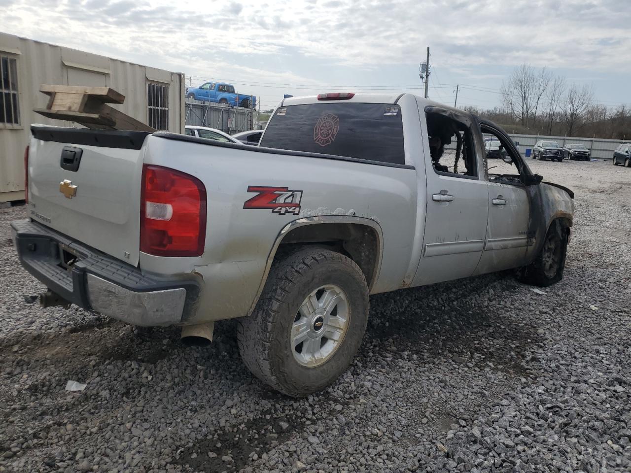 2010 Chevrolet Silverado VIN 3GCRKSE34AG198935 Copart auction photo, burn damage thumbnail 3