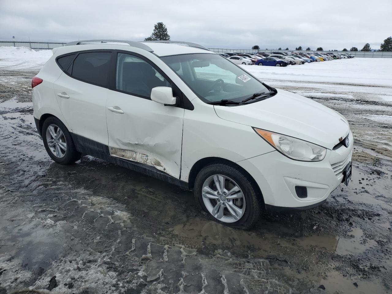 2010 Hyundai Tucson VIN KM8JUCAC9AU098406 Copart auction photo, side / front end damage thumbnail 4