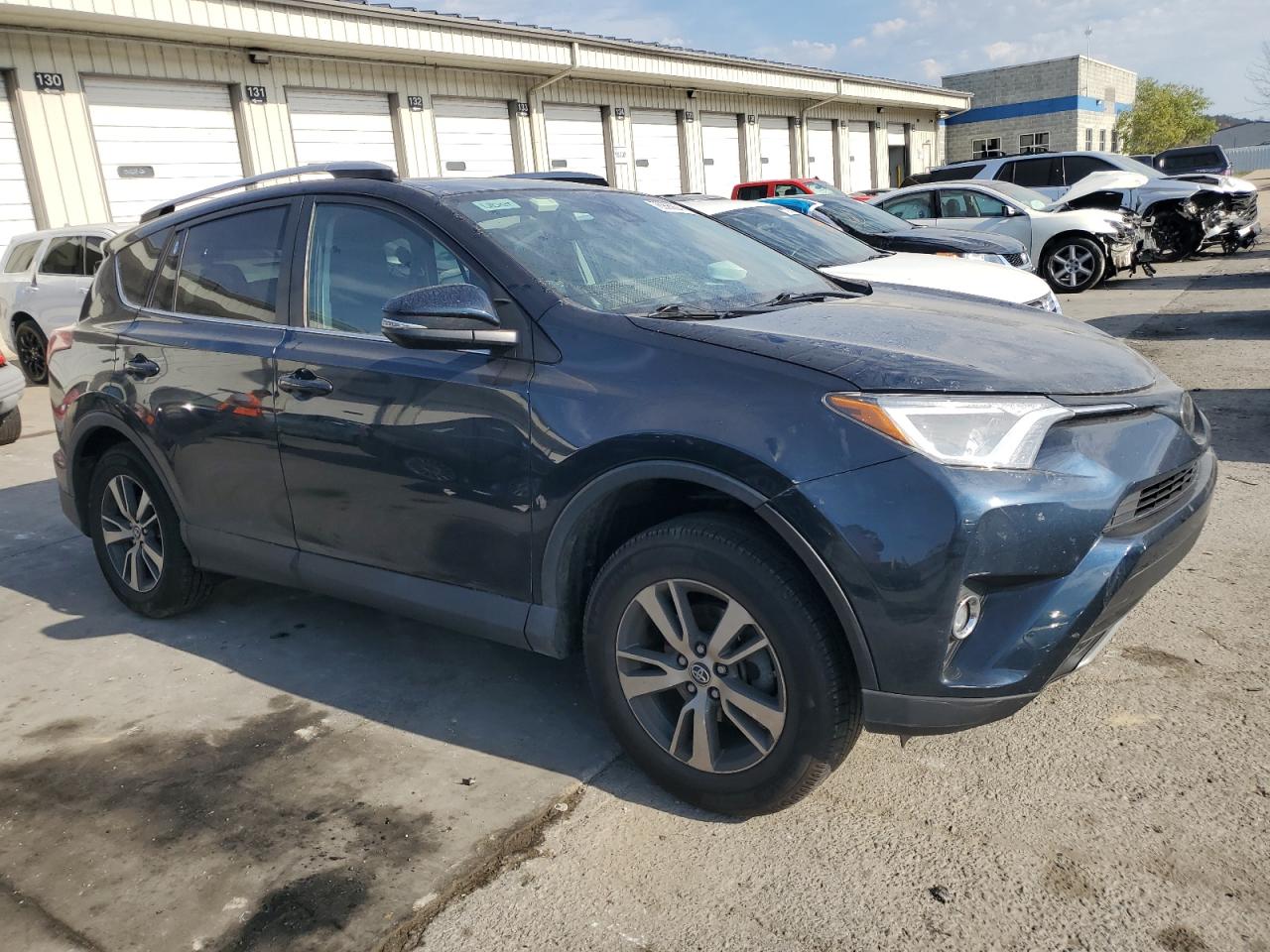 2017 Toyota RAV 4 VIN 2T3WFREV2HW318601 Copart auction photo, side / rear end damage thumbnail 4
