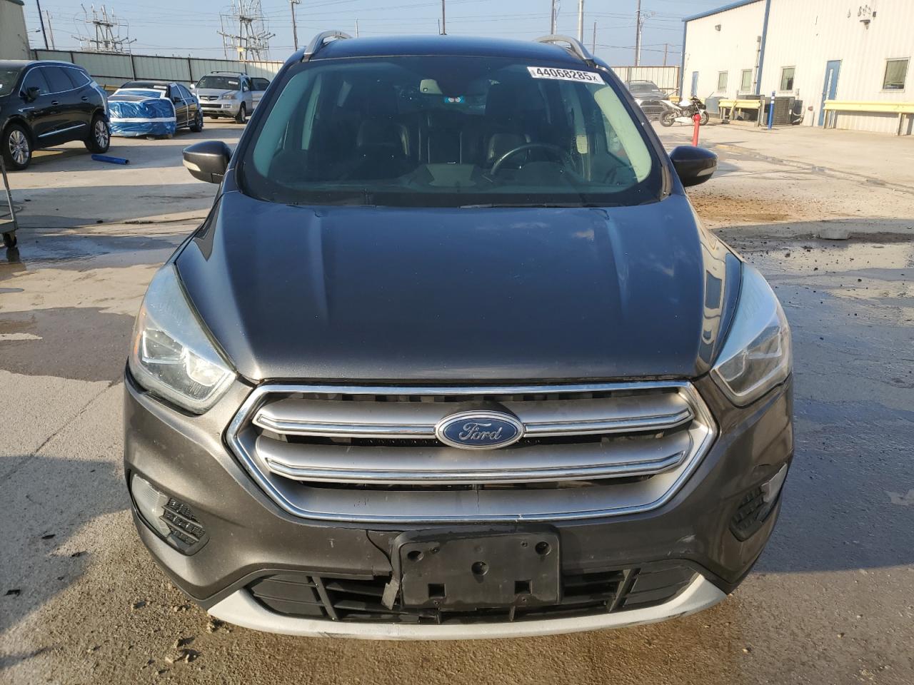 2017 Ford Escape VIN 1FMCU0J99HUF05792 Copart auction photo, front end / minor dent/scratches damage thumbnail 5