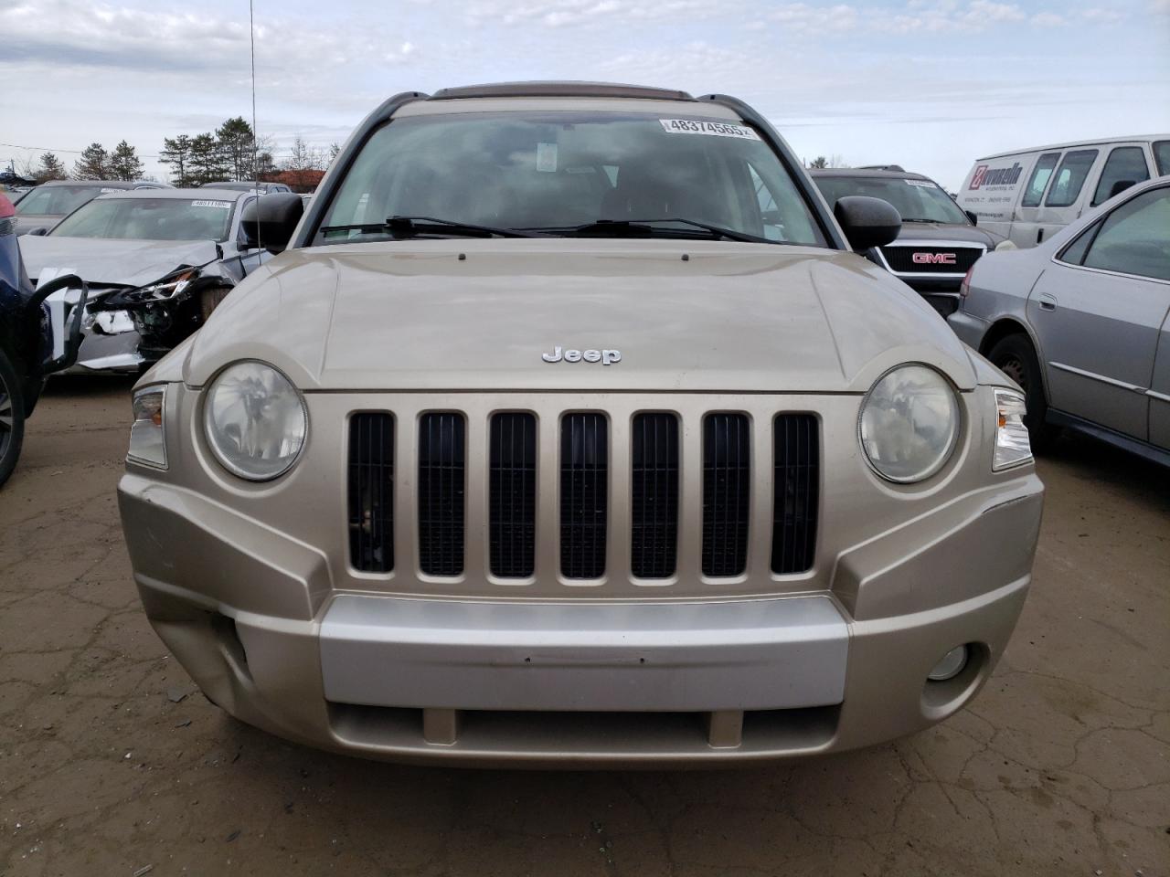 2010 Jeep Compass VIN 1J4NF5FB9AD599690 Copart auction photo, side / minor dent/scratches damage thumbnail 5