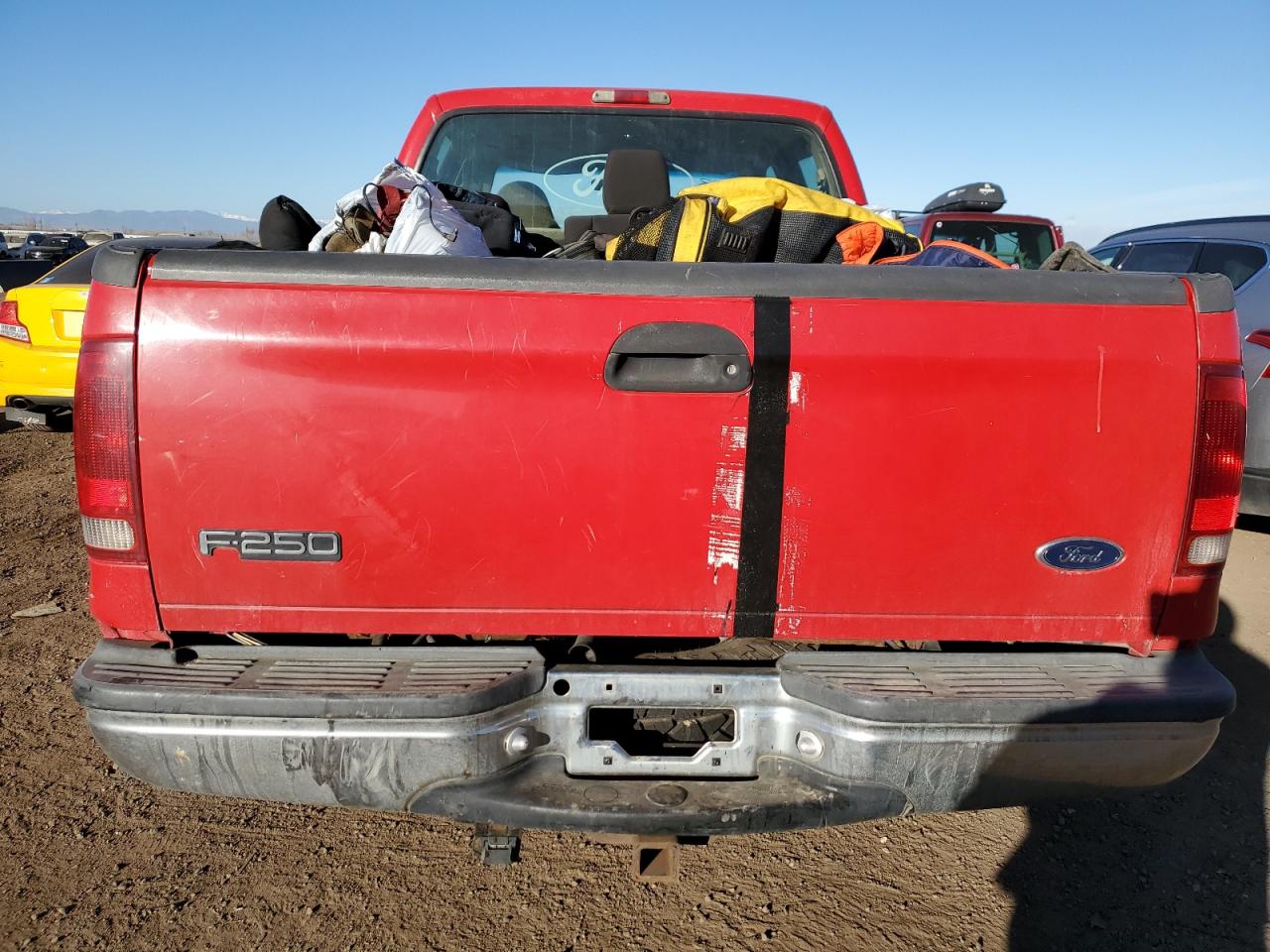 1999 Ford F250 VIN 1FTNW21S6XEA92910 Copart auction photo, vandalism damage thumbnail 6