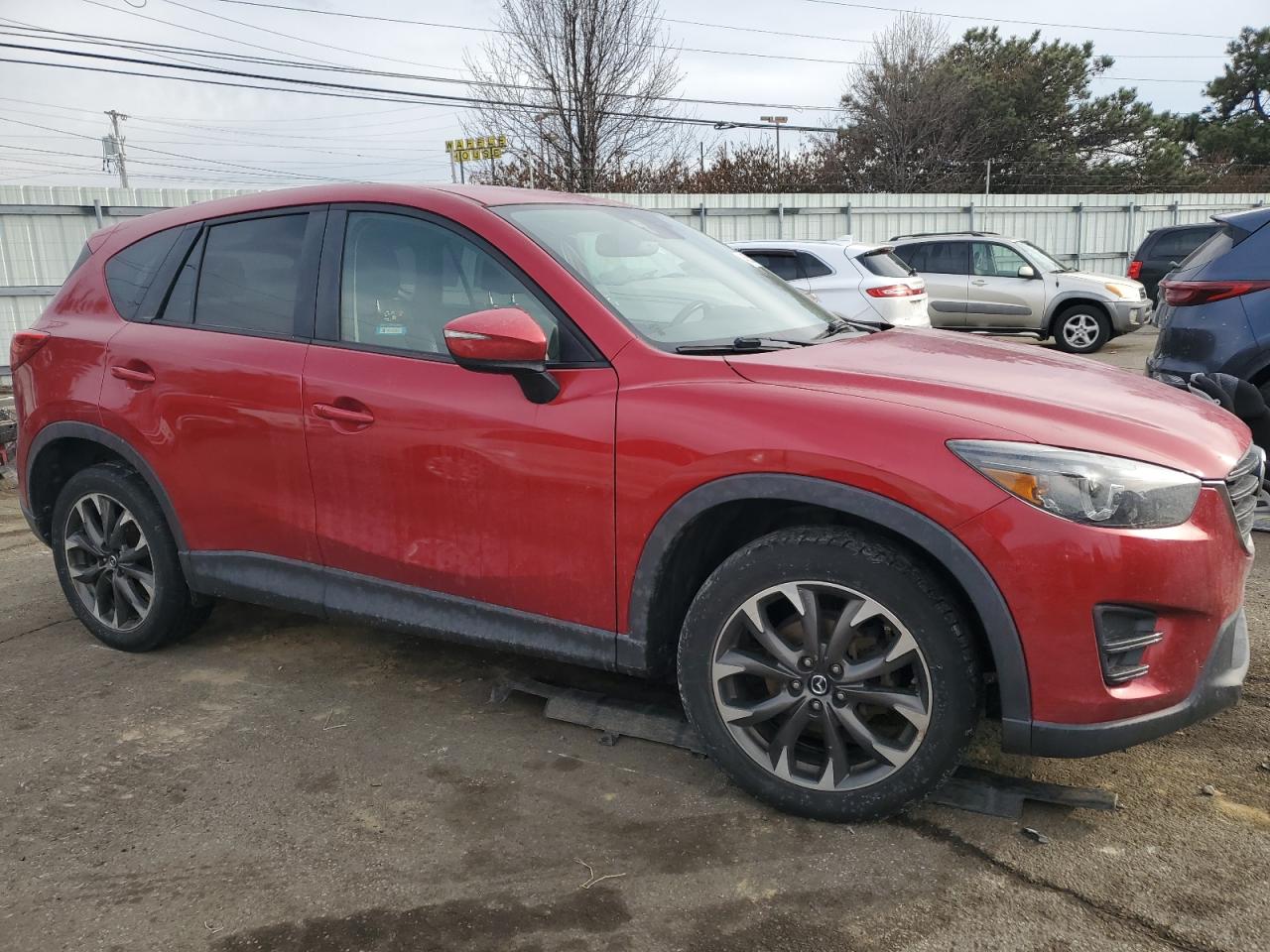 2016 Mazda CX-5 VIN JM3KE4DY3G0644238 Copart auction photo, all over damage thumbnail 4