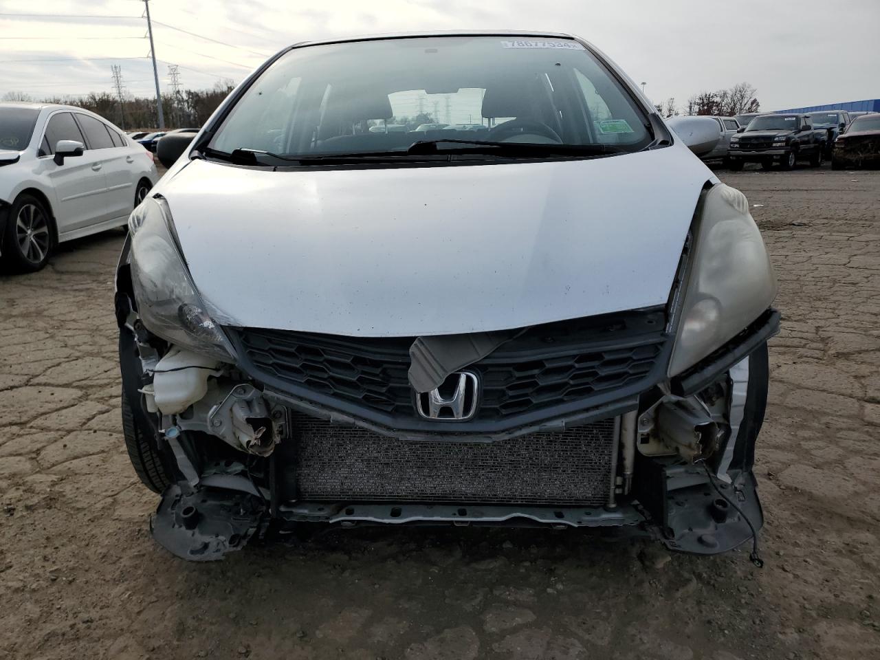 2012 Honda Fit VIN JHMGE8H57CS003385 Copart auction photo, all over damage thumbnail 5