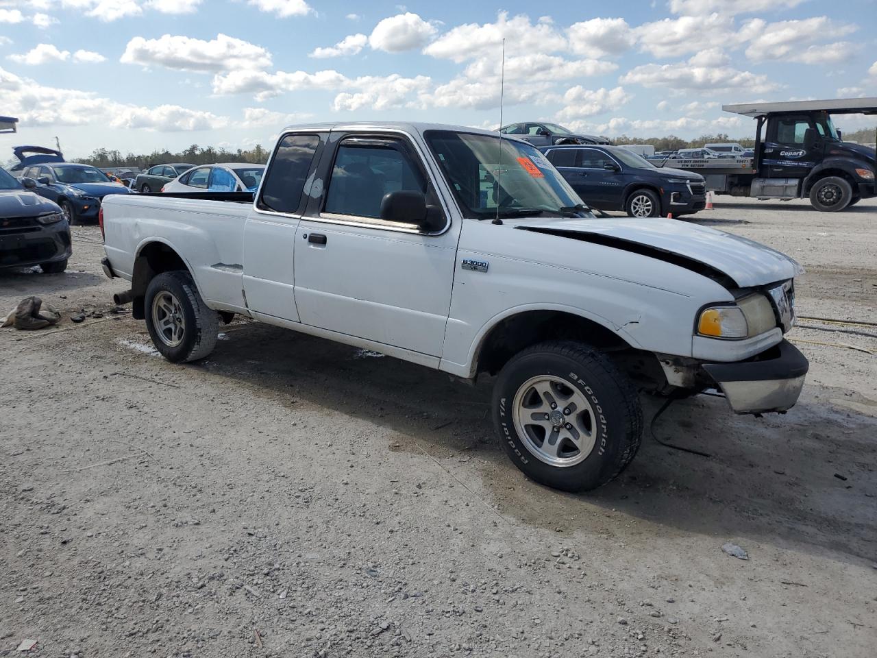 2000 Mazda B-series VIN 4F4YR16VXYTM31299 Copart auction photo, front end / side damage thumbnail 4