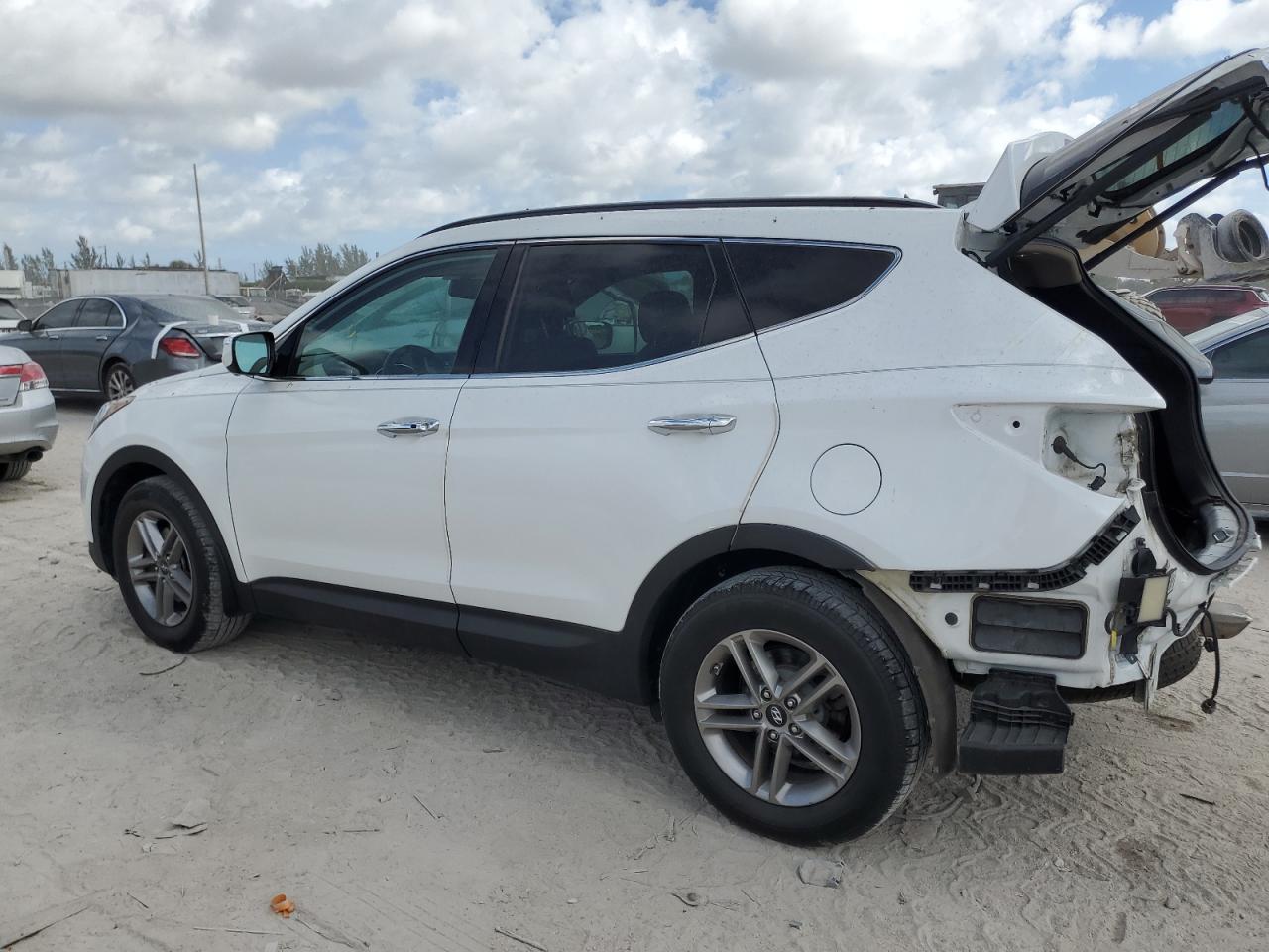 2017 Hyundai Santa Fe VIN 5XYZUDLBXHG413792 Copart auction photo, rear end / minor dent/scratches damage thumbnail 2