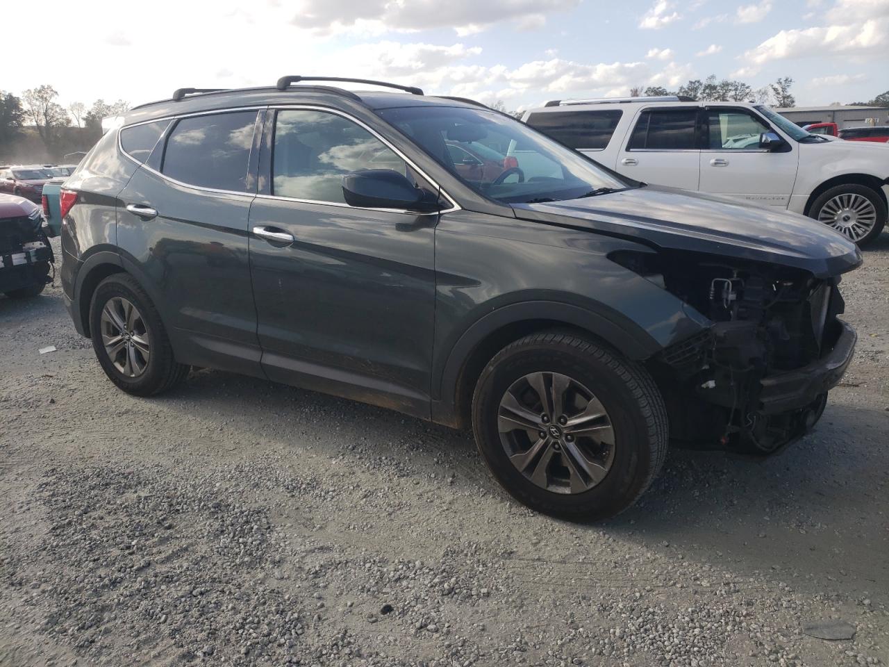 2014 Hyundai Santa Fe VIN 5XYZUDLB2EG164979 Copart auction photo, front end / minor dent/scratches damage thumbnail 4