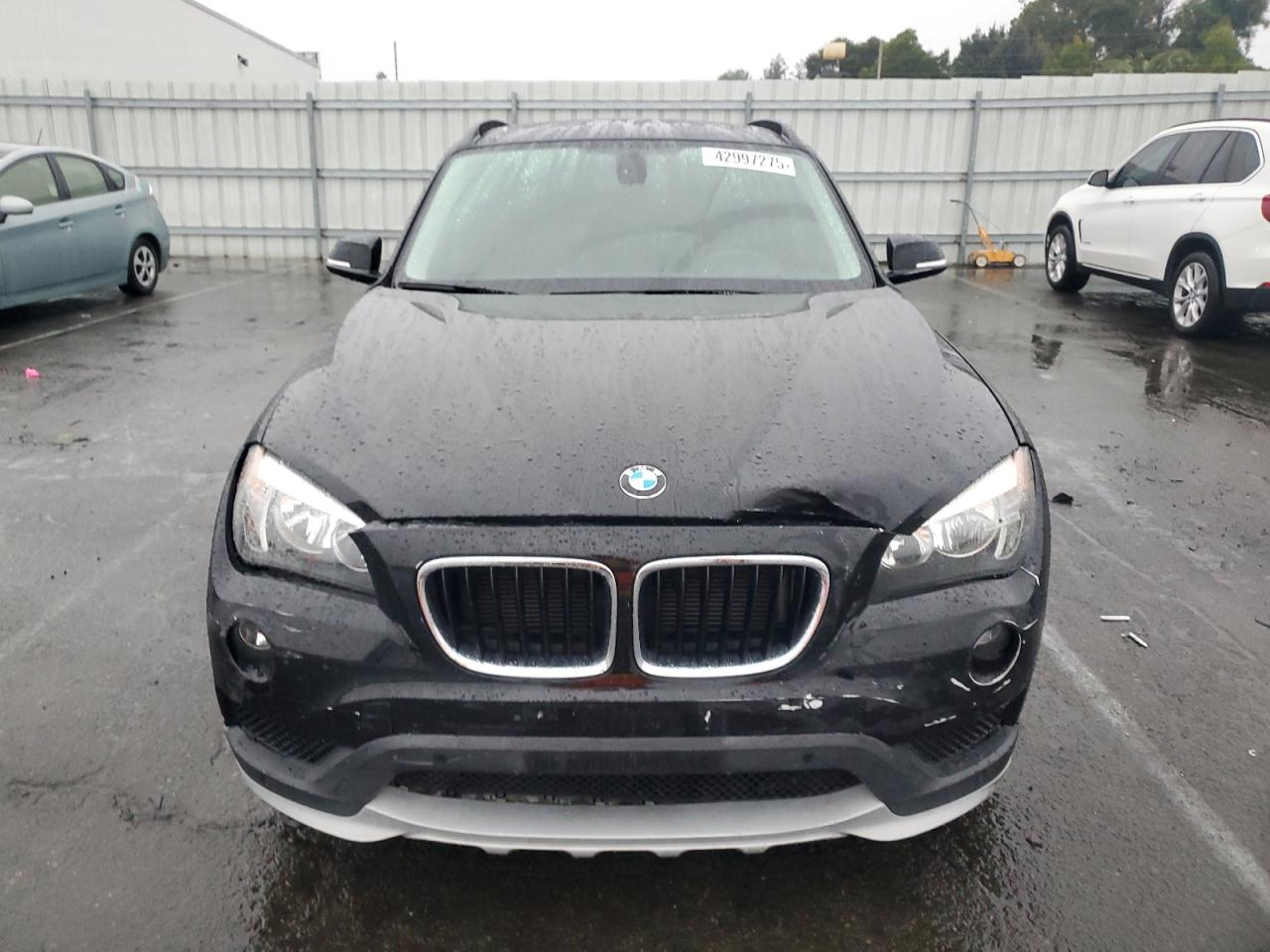 2015 BMW X1 VIN WBAVM1C52FV498069 Copart auction photo, front end / side damage thumbnail 5