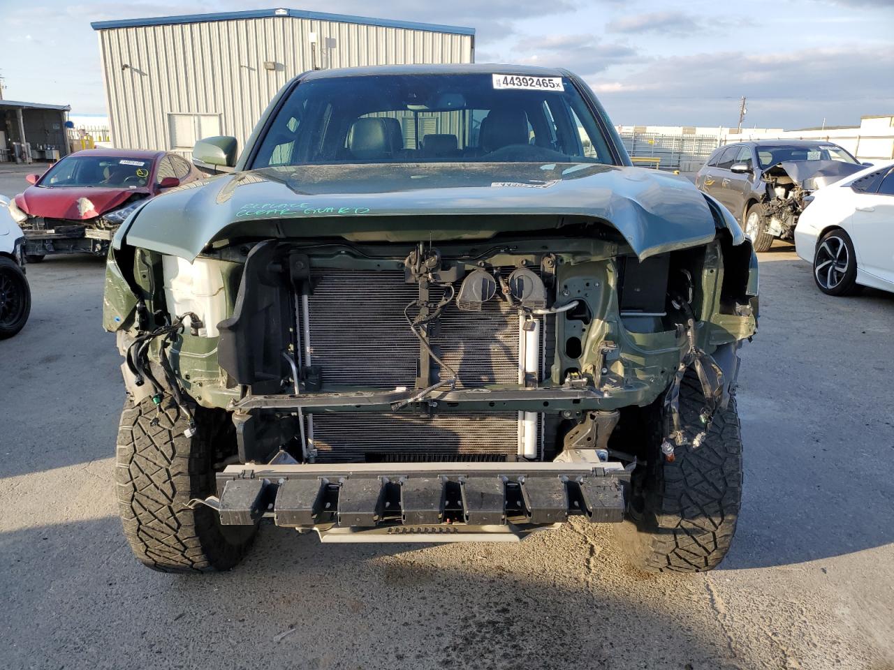 2021 Toyota Tacoma VIN 3TMDZ5BN2MM108927 Copart auction photo, front end / side damage thumbnail 5