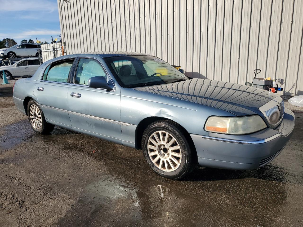 2004 Lincoln Town Car VIN 1LNHM81W54Y652818 Copart auction photo, side / rear end damage thumbnail 4