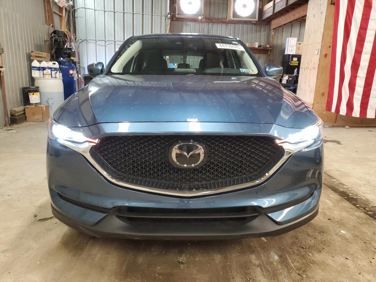 2020 Mazda CX-5 VIN JM3KFBBM4L0799974 Copart auction photo, side damage thumbnail 5