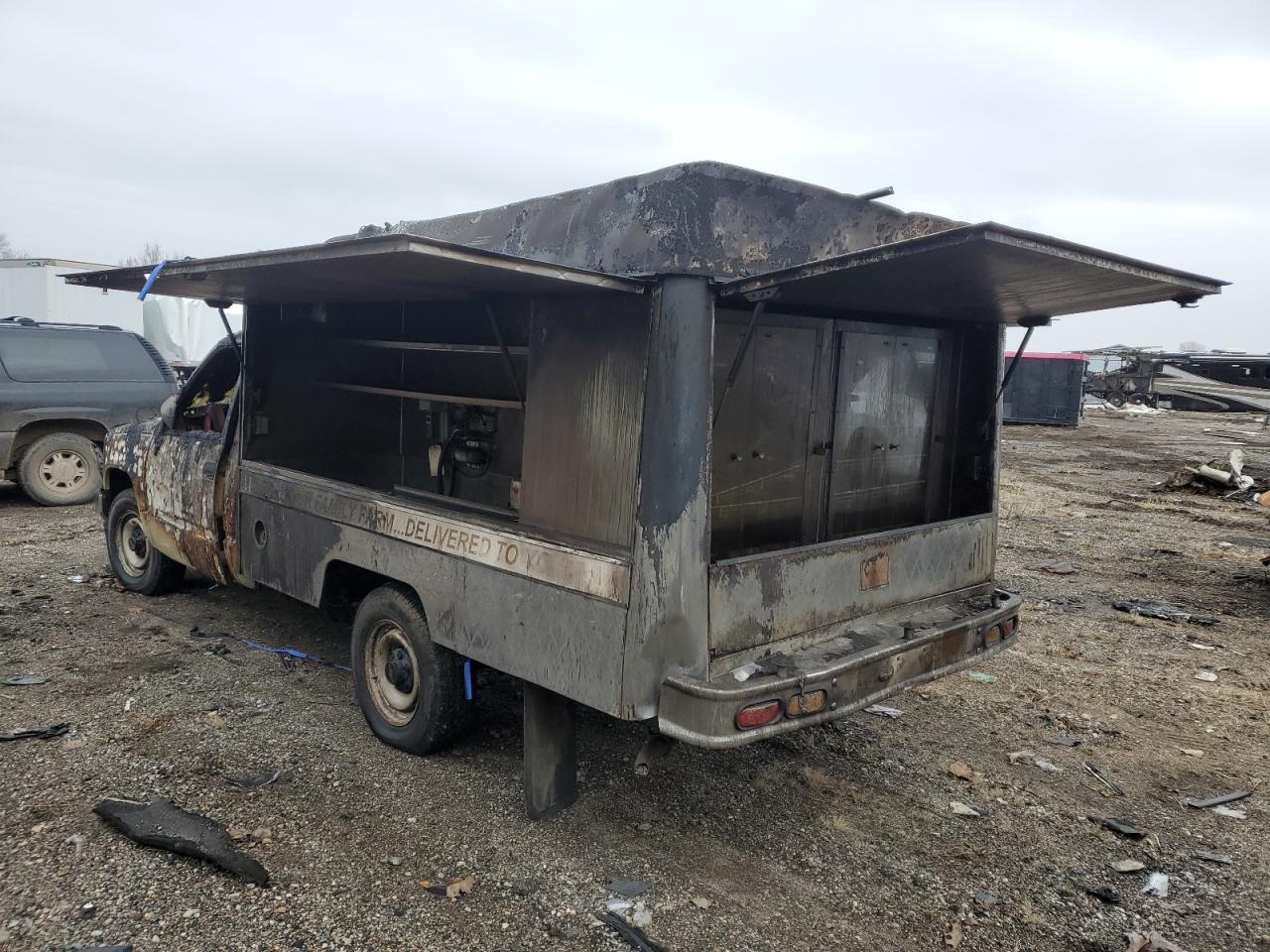 1990 Chevrolet GMT-400 VIN 1GCFC24H0LE205869 Copart auction photo, burn damage thumbnail 2