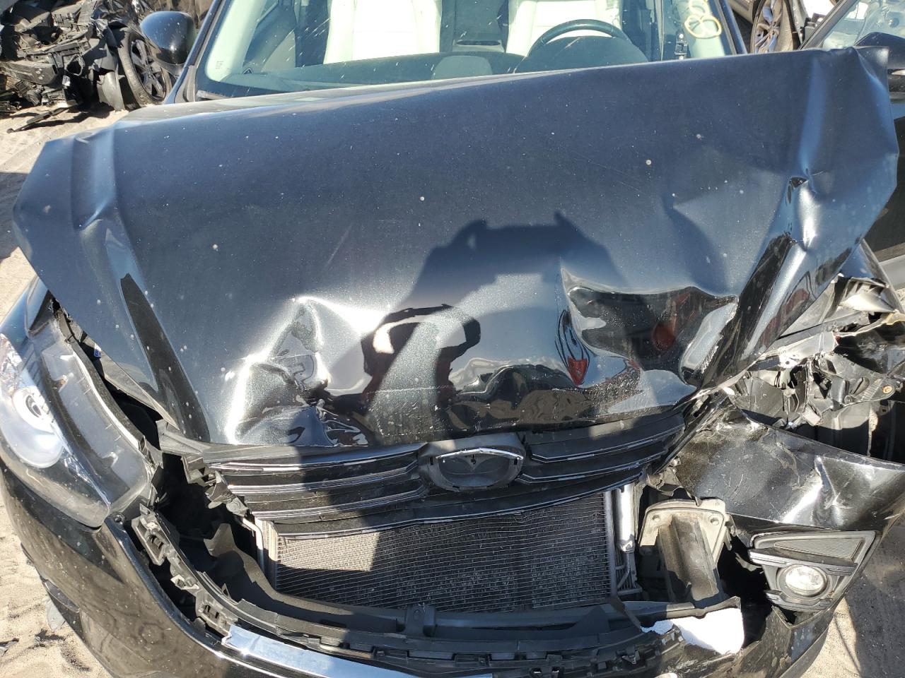 2016 Mazda CX-5 VIN JM3KE4DY6G0777141 Copart auction photo, front end / minor dent/scratches damage thumbnail 12