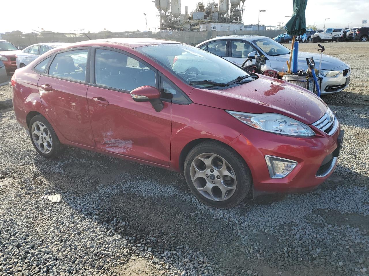 2011 Ford Fiesta VIN 3FADP4CJ5BM203108 Copart auction photo, side damage thumbnail 4