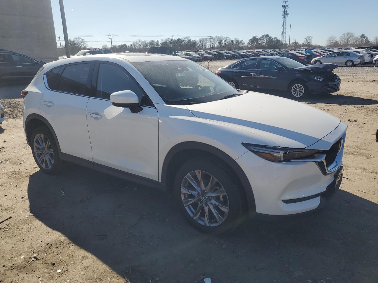 2021 Mazda CX-5 VIN JM3KFBDM8M1315362 Copart auction photo, side / rear end damage thumbnail 4
