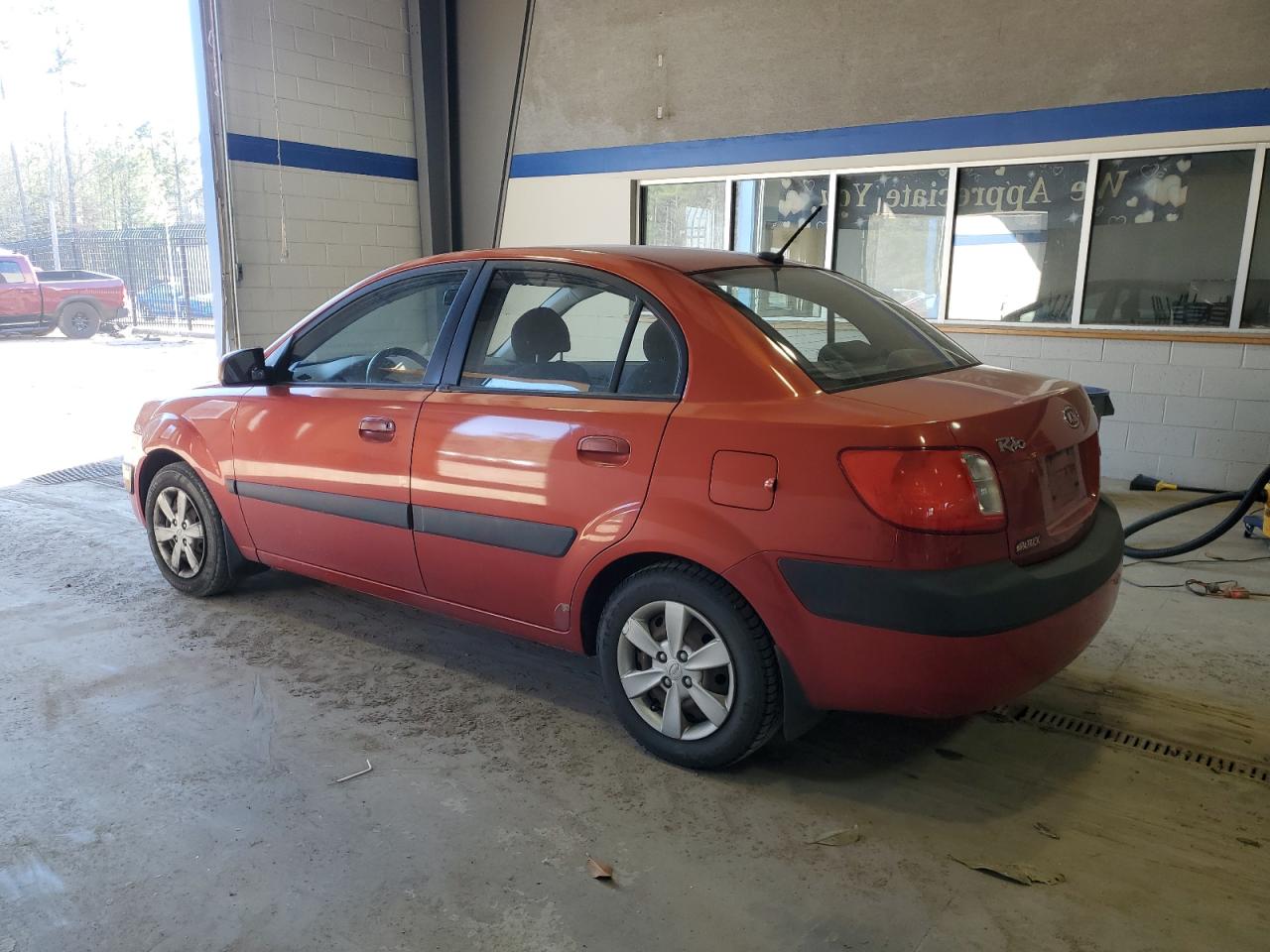 2009 KIA Rio VIN KNADE223996534062 Copart auction photo, side damage thumbnail 2