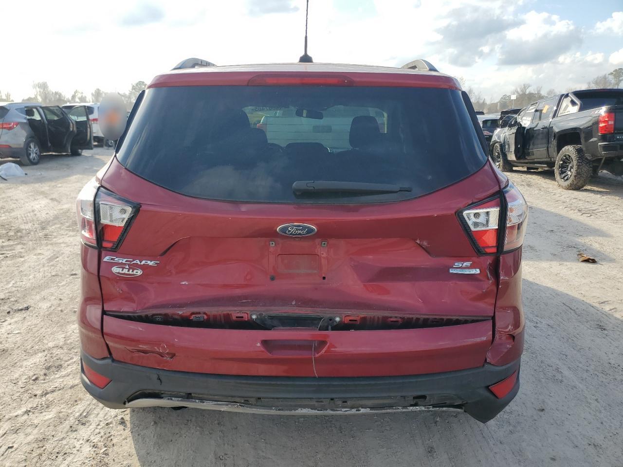 2018 Ford Escape VIN 1FMCU0GD6JUA54435 Copart auction photo, rear end / minor dent/scratches damage thumbnail 6