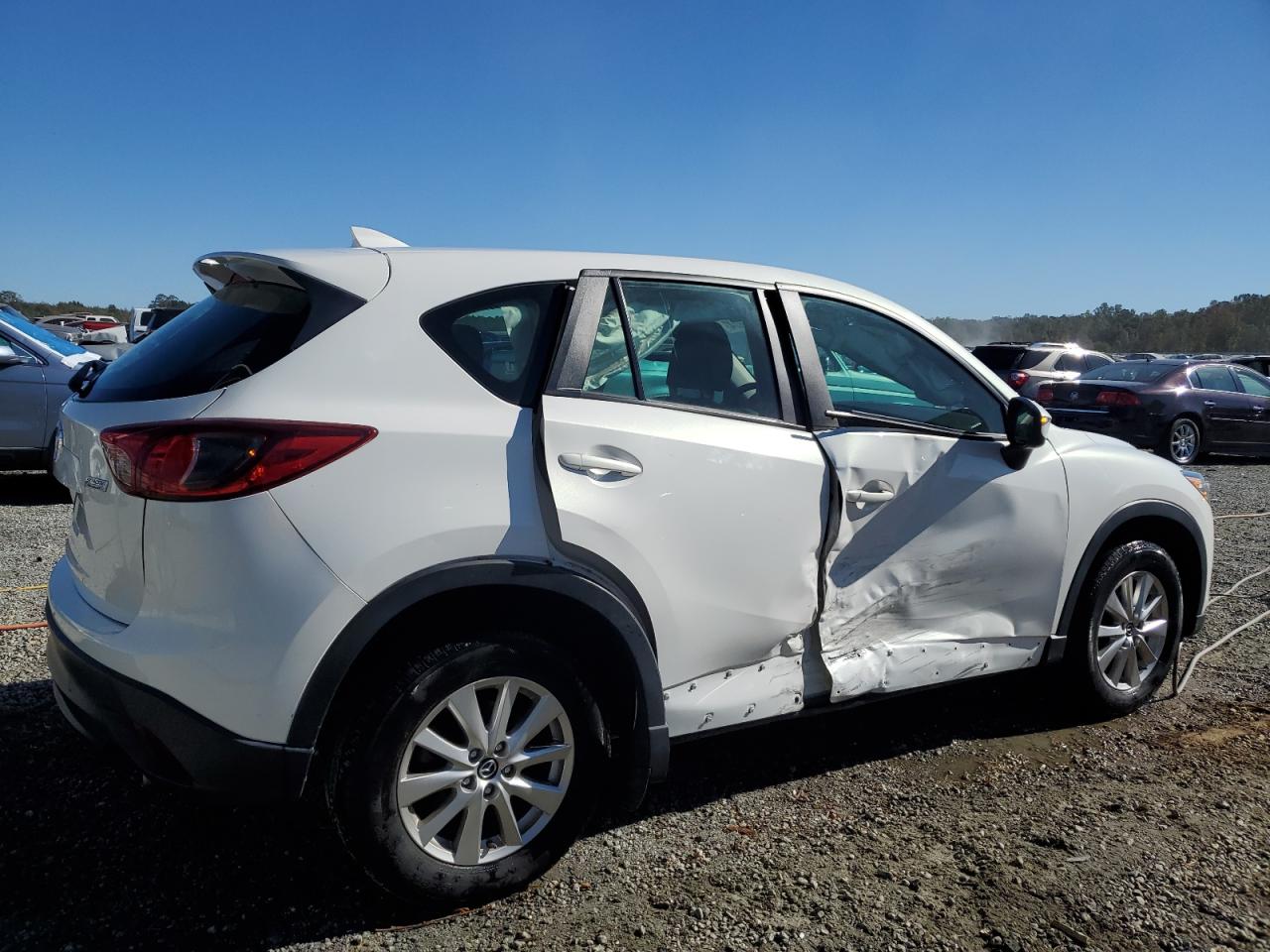 2016 Mazda CX-5 VIN JM3KE4BY9G0850537 Copart auction photo, side / minor dent/scratches damage thumbnail 3
