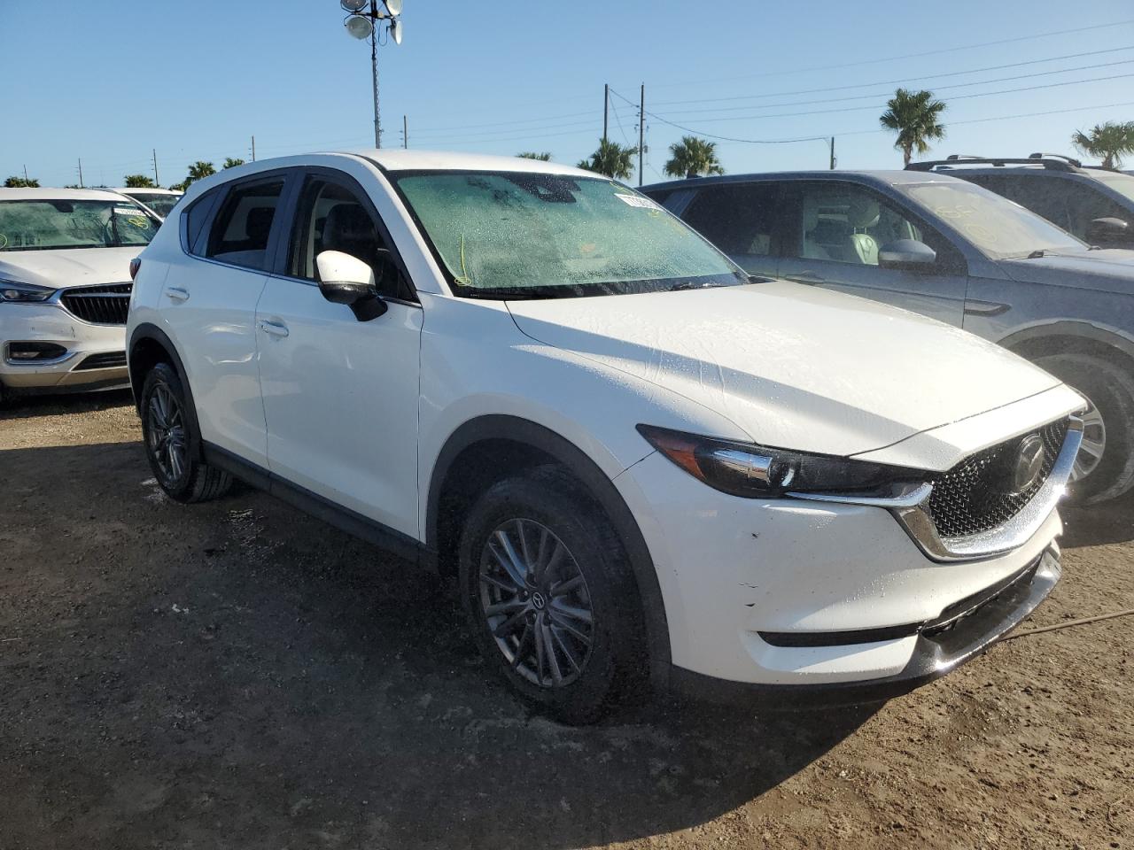 2021 Mazda CX-5 VIN JM3KFBCM5M0356619 Copart auction photo, water/flood damage thumbnail 4