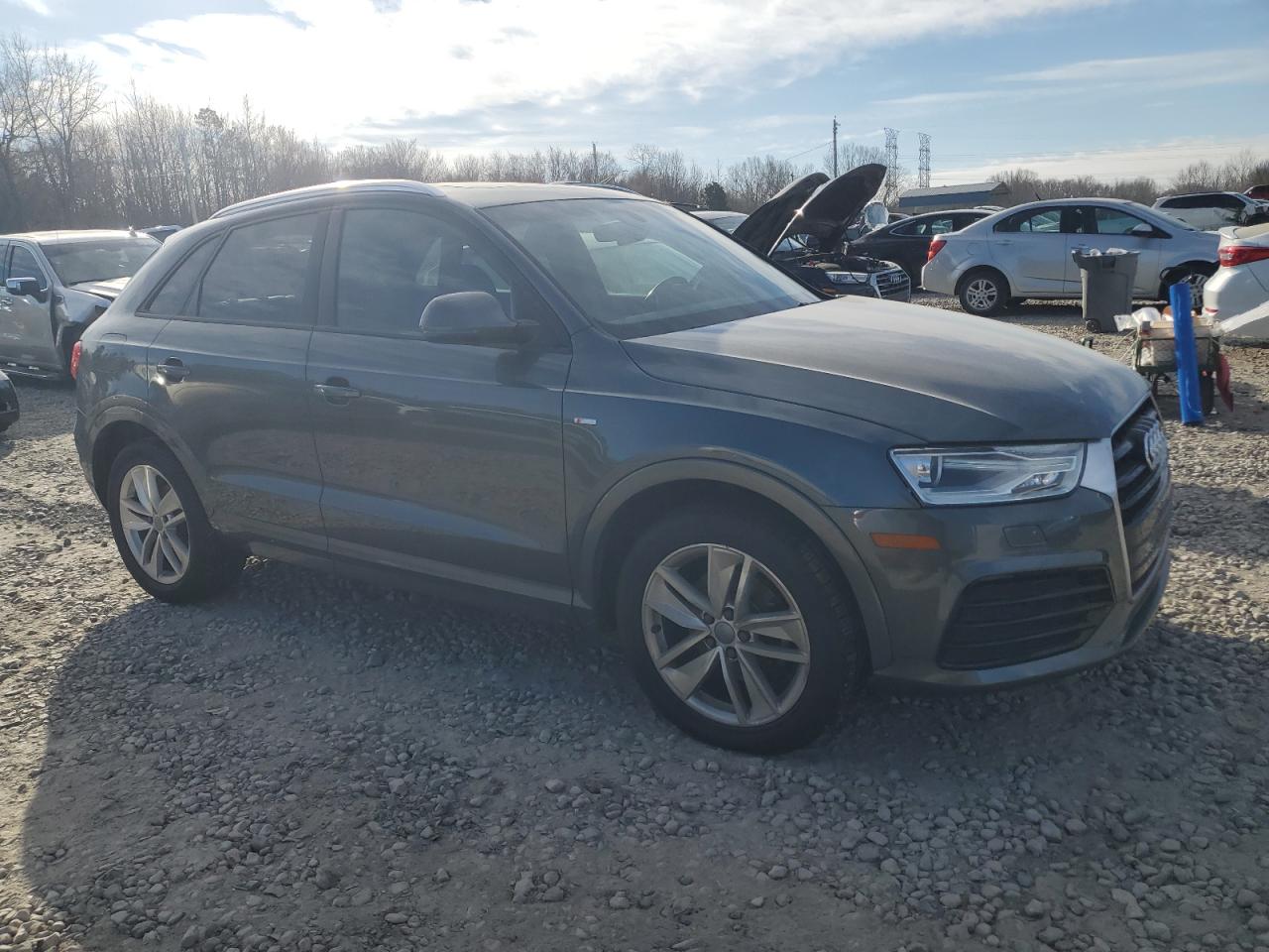 2018 Audi Q3 VIN WA1BCCFS1JR000879 Copart auction photo, vandalism damage thumbnail 4