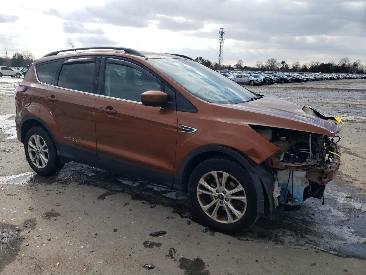 2017 Ford Escape VIN 1FMCU0GD5HUC97700 Copart auction photo, front end / minor dent/scratches damage thumbnail 4