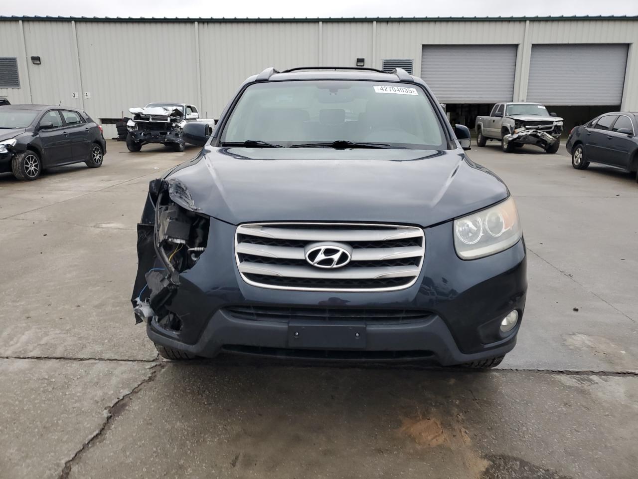 2012 Hyundai Santa Fe VIN 5XYZK4AG7CG161724 Copart auction photo, front end damage thumbnail 5