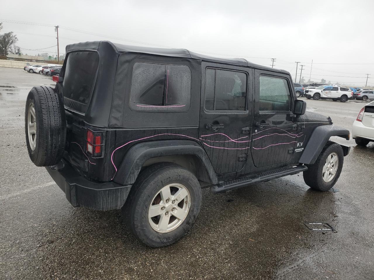 2009 Jeep Wrangler VIN 1J4GA39119L755818 Copart auction photo, vandalism damage thumbnail 3