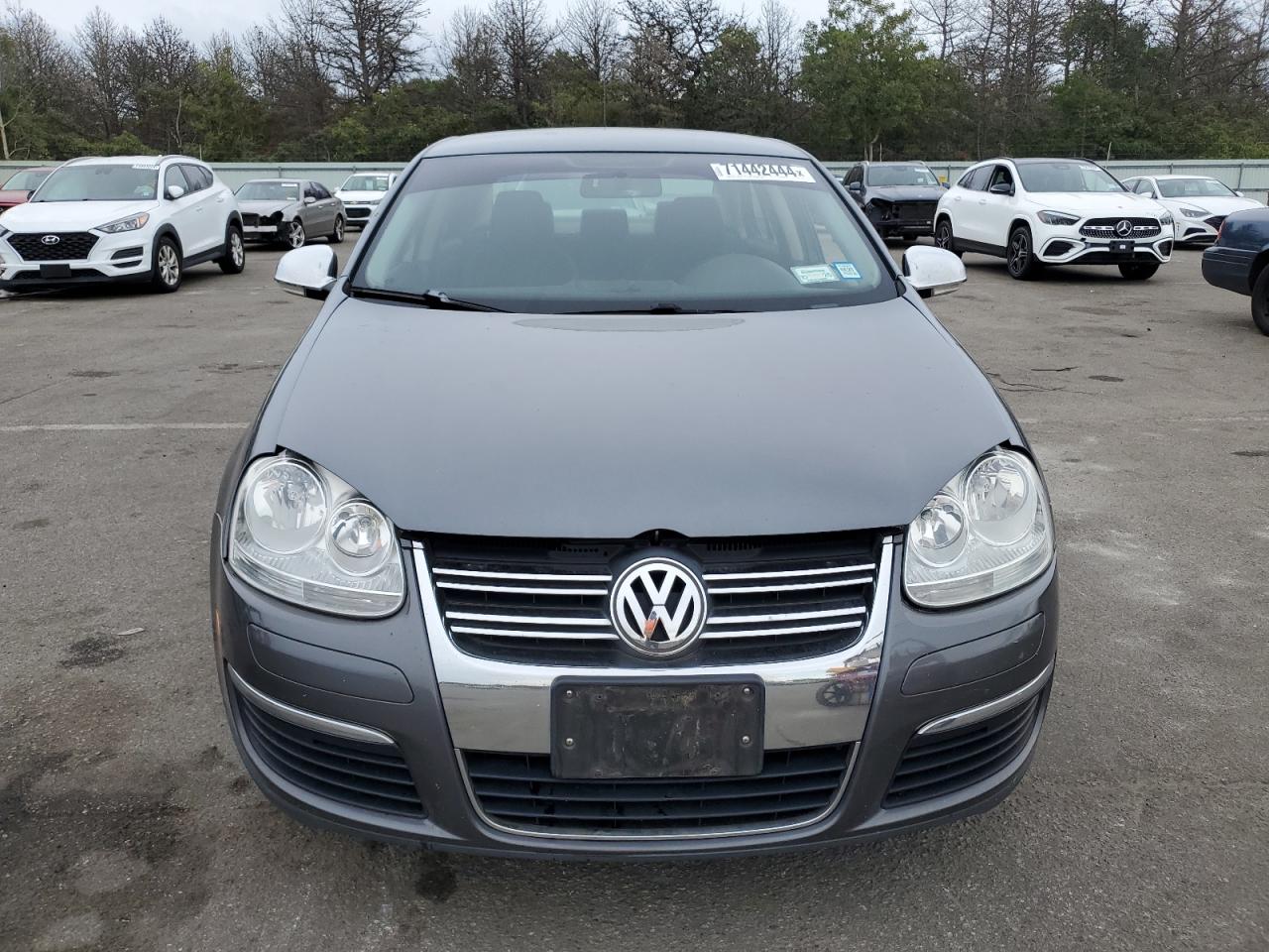 2009 Volkswagen Jetta VIN 3VWJZ71K59M176410 Copart auction photo, undercarriage damage thumbnail 5