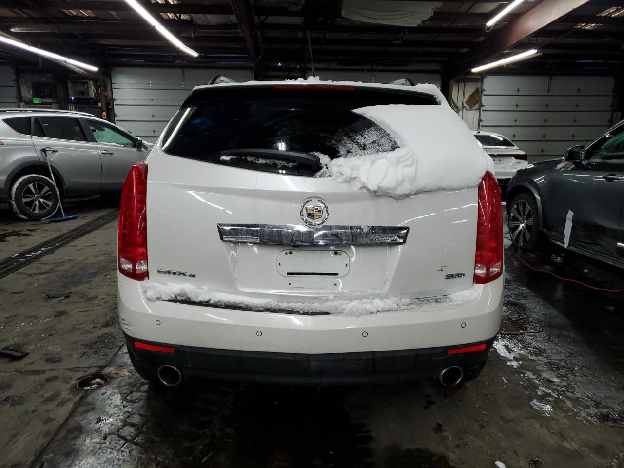 2015 Cadillac SRX VIN 3GYFNEE38FS510118 Copart auction photo, rollover damage thumbnail 6
