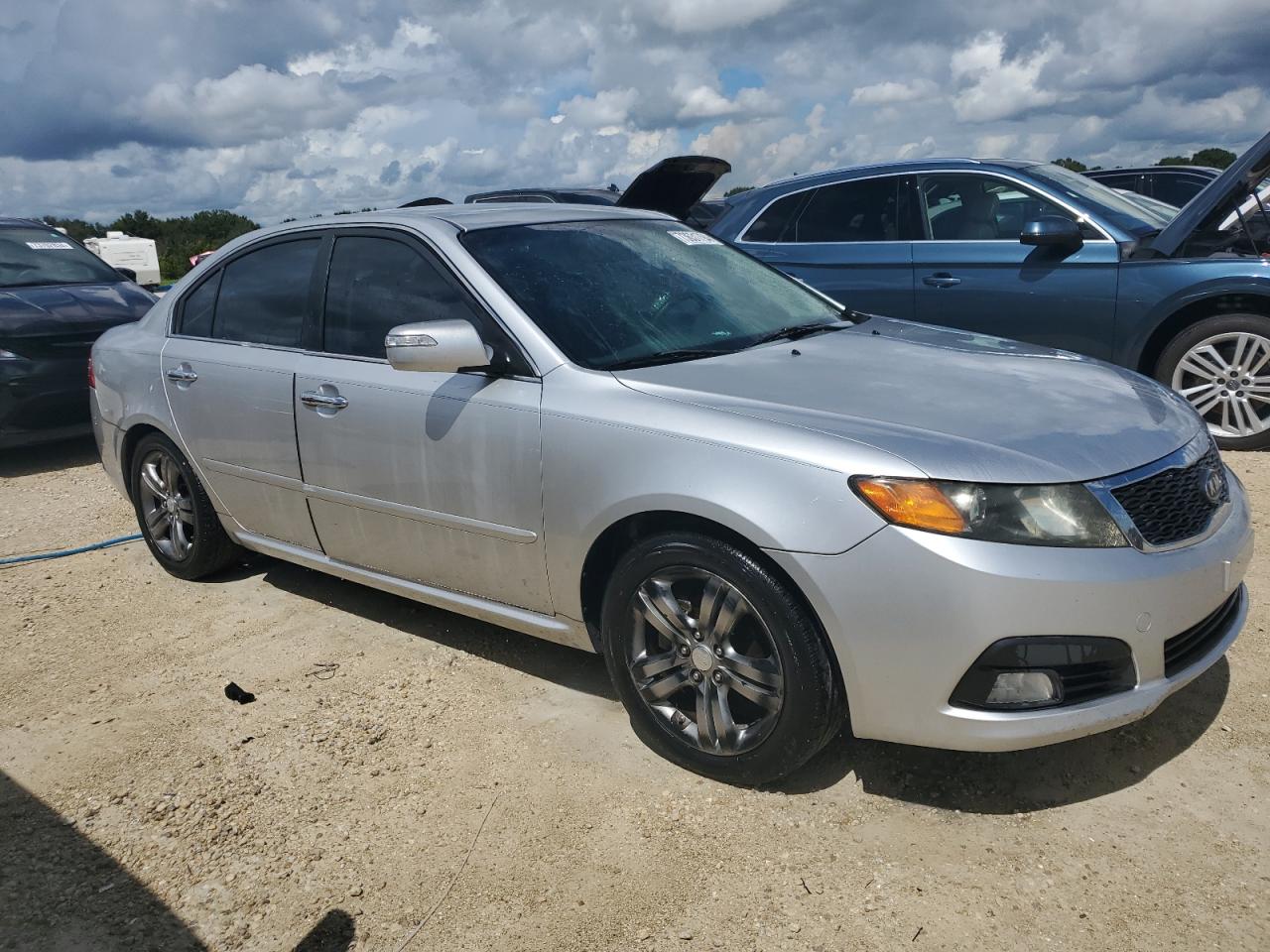 2009 KIA Optima VIN KNAGE224395333740 Copart auction photo, water/flood damage thumbnail 4