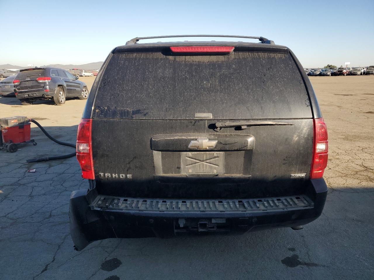 2009 Chevrolet Tahoe VIN 1GNFC23049R101471 Copart auction photo, vandalism / rear end damage thumbnail 6