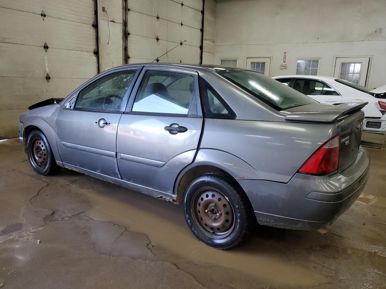 2005 Ford Focus VIN 1FAFP34N35W138316 Copart auction photo, all over damage thumbnail 2