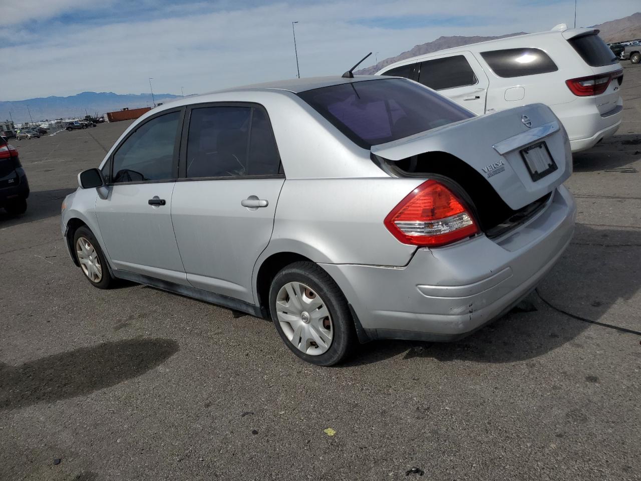 2010 Nissan Versa VIN 3N1BC1AP8AL355829 Copart auction photo, rear end / front end damage thumbnail 2