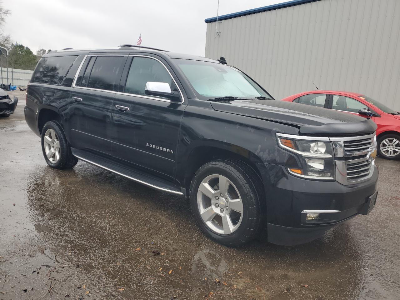 2017 Chevrolet Suburban VIN 1GNSCJKCXHR177327 Copart auction photo, water/flood damage thumbnail 4