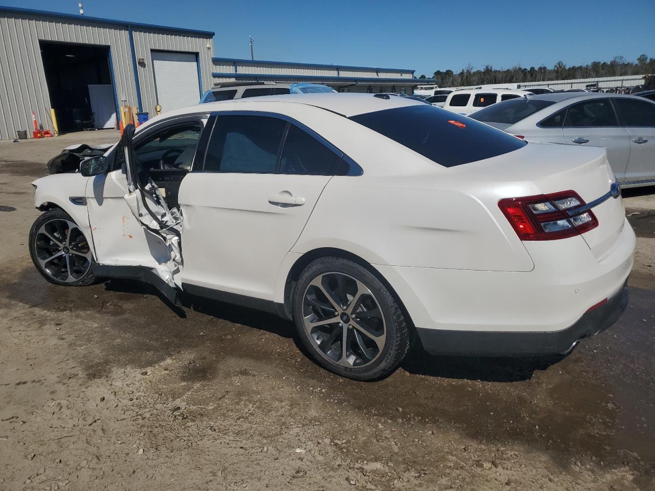 2015 Ford Taurus VIN 1FAHP2E8XFG123612 Copart auction photo, front end / side damage thumbnail 2