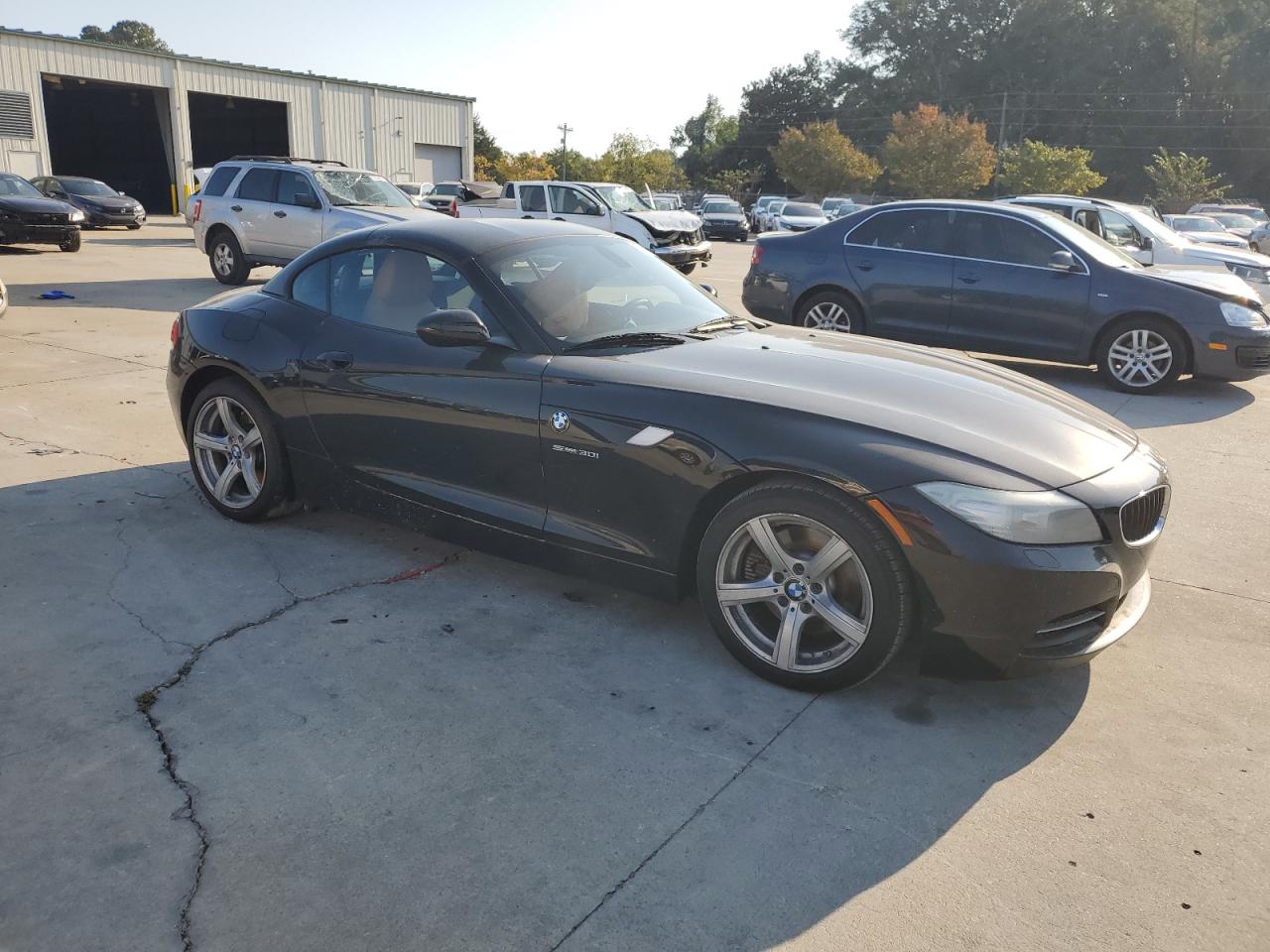 2011 BMW Z4 VIN WBALM5C59BE378391 Copart auction photo, water/flood damage thumbnail 4