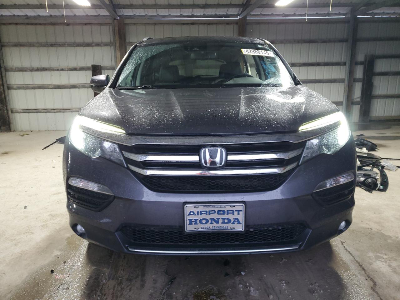2018 Honda Pilot VIN 5FNYF6H06JB069948 Copart auction photo, all over damage thumbnail 5