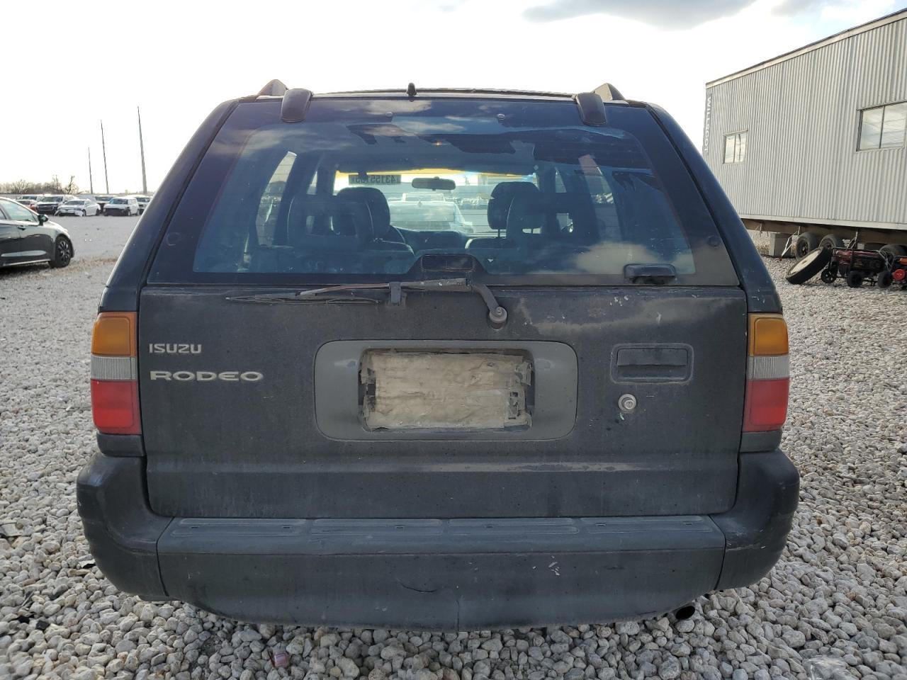 1999 Isuzu Rodeo VIN 4S2CK58W3X4362974 Copart auction photo, side damage thumbnail 6
