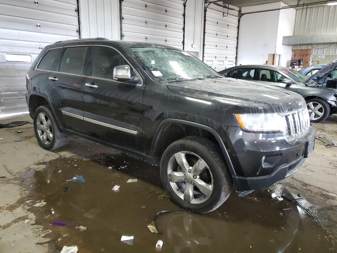 2013 Jeep Grand Cherokee VIN 1C4RJFCGXDC606880 Copart auction photo, rear end damage thumbnail 4