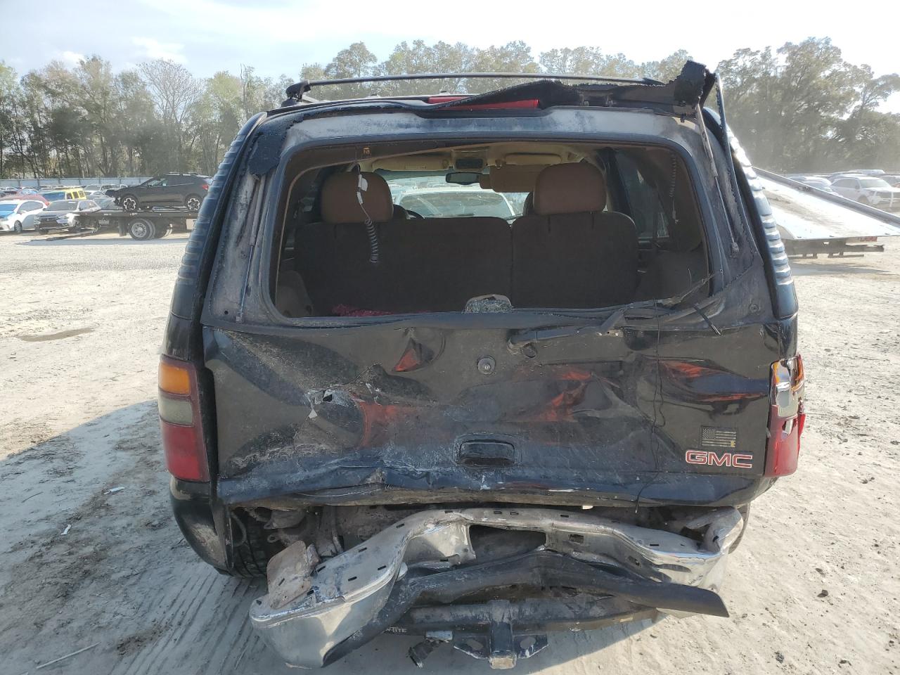 2000 GMC Yukon VIN 1GKEK13T7YJ160589 Copart auction photo, rear end / minor dent/scratches damage thumbnail 6