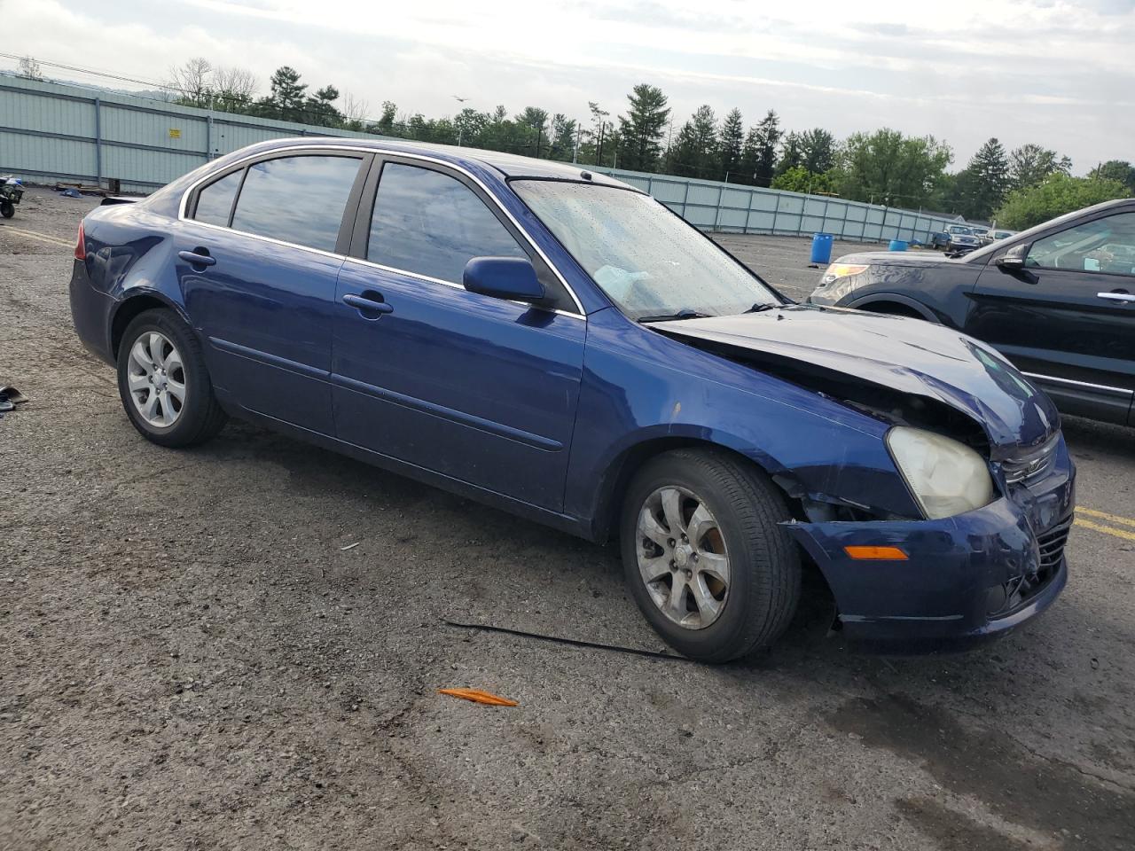 2006 KIA Optima VIN KNAGE124265027098 Copart auction photo, front end / rear end damage thumbnail 4
