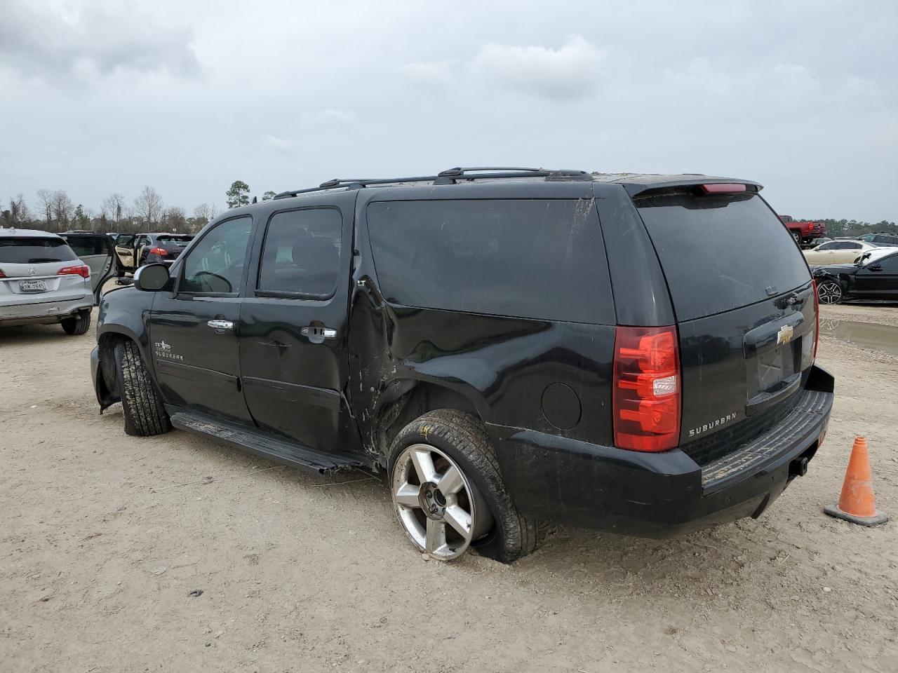 2011 Chevrolet Suburban VIN 1GNSCJE07BR289849 Copart auction photo, side / front end damage thumbnail 2