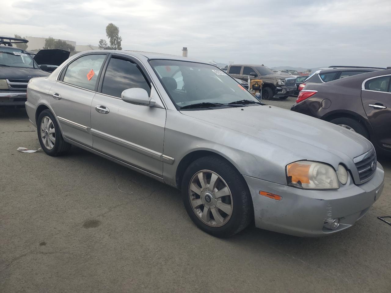 2004 KIA Optima VIN KNAGD128445296111 Copart auction photo, vandalism damage thumbnail 4