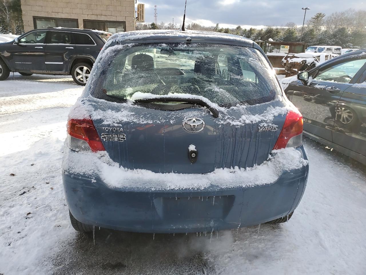 2009 Toyota Yaris VIN JTDKT903195234257 Copart auction photo, front end / minor dent/scratches damage thumbnail 6