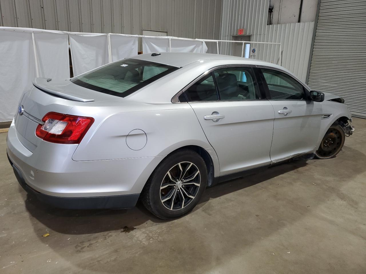 2012 Ford Taurus VIN 1FAHP2DW4CG140711 Copart auction photo, front end / side damage thumbnail 3
