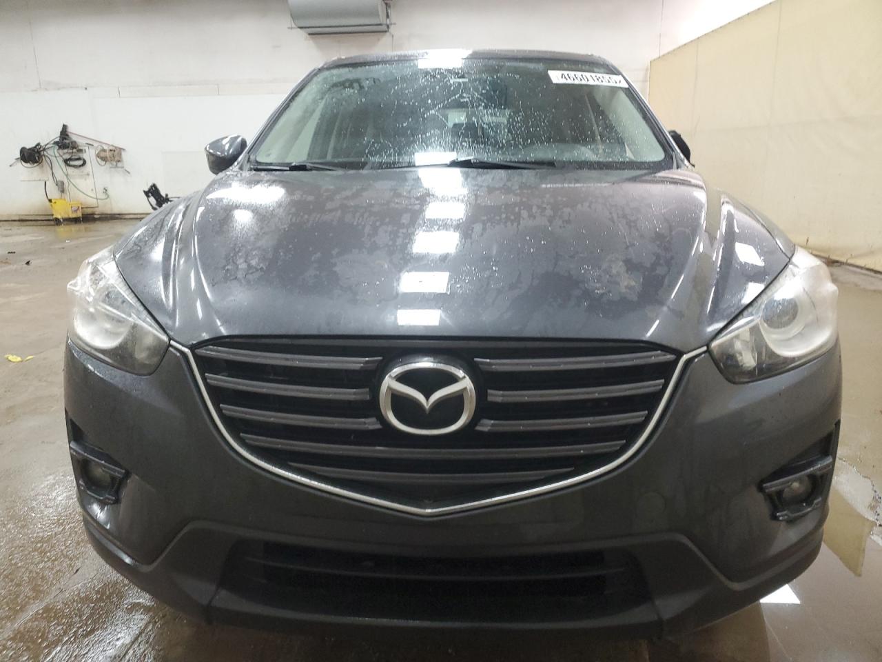 2016 Mazda CX-5 VIN JM3KE4DY8G0873109 Copart auction photo, side / minor dent/scratches damage thumbnail 5