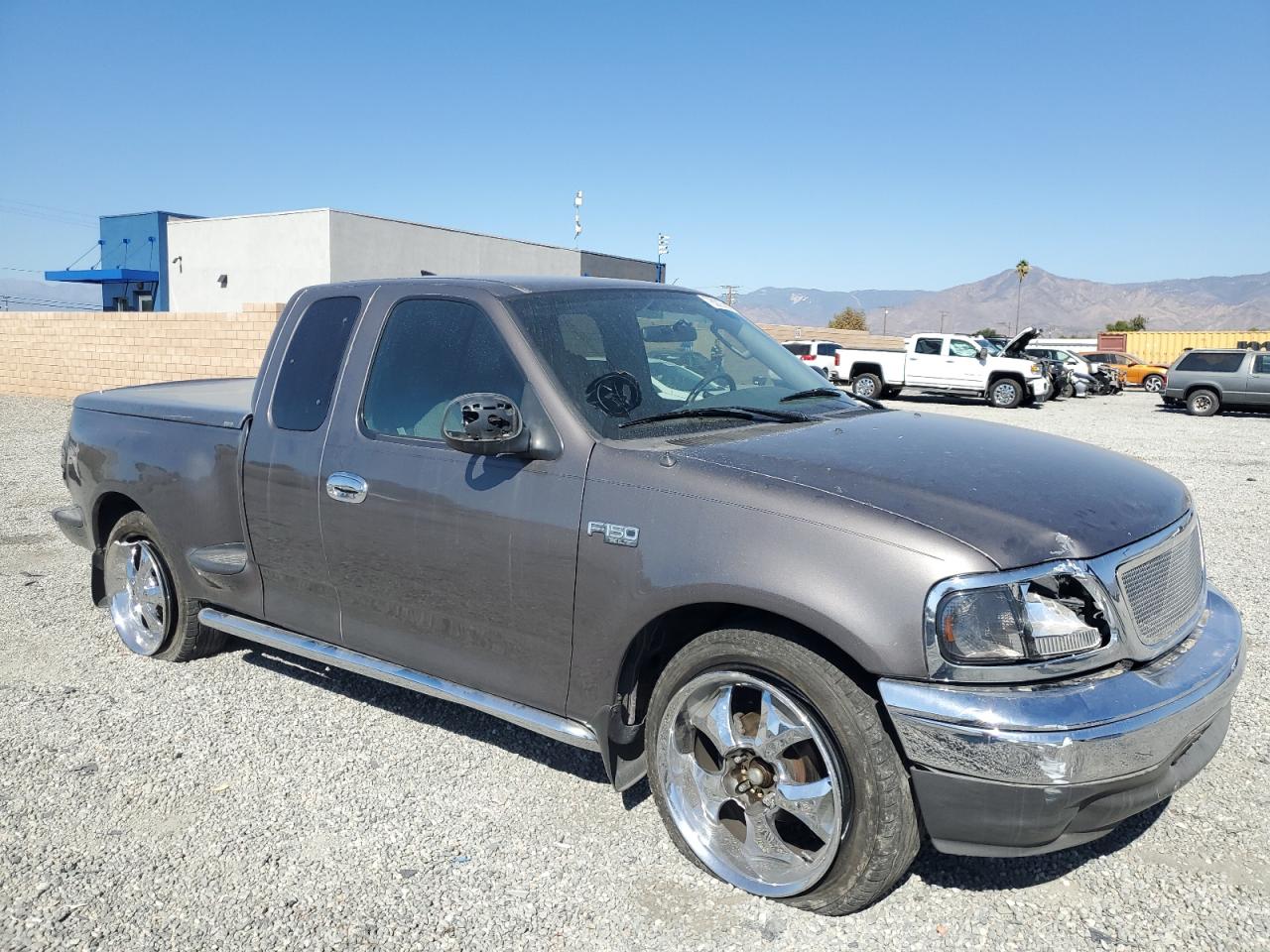 2003 Ford F-150 VIN 1FTRX07233KC40260 Copart auction photo, side / front end damage thumbnail 4