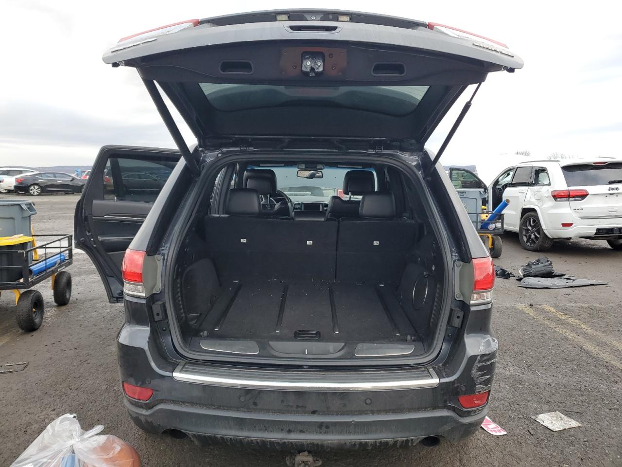 2014 Jeep Grand Cherokee VIN 1C4RJFBG6EC237437 Copart auction photo, undercarriage / side damage thumbnail 6