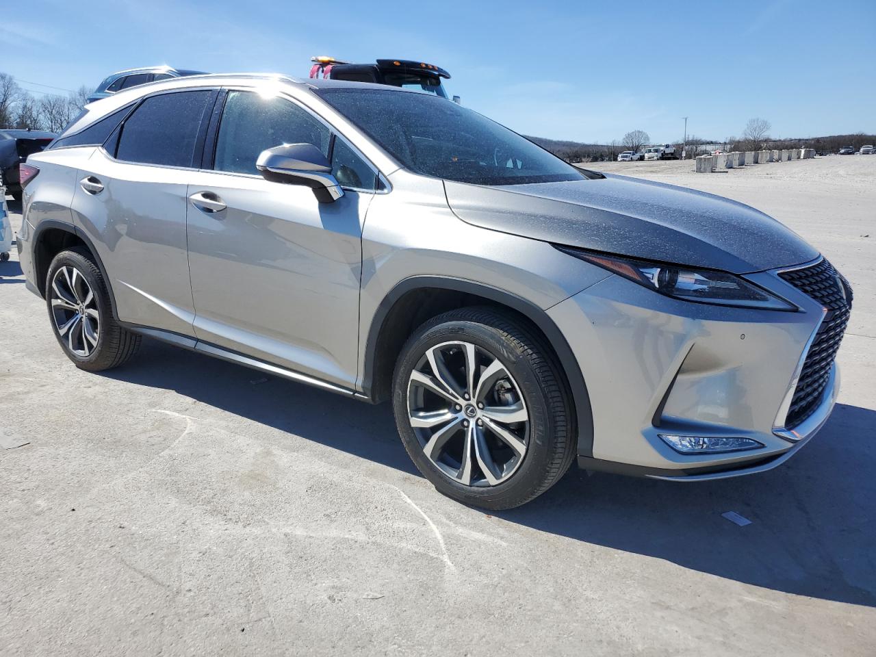 2022 Lexus RX VIN 2T2HZMAA2NC220630 Copart auction photo, side / minor dent/scratches damage thumbnail 4