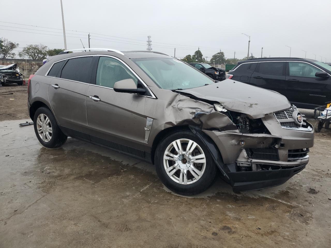 2011 Cadillac SRX VIN 3GYFNAEY8BS628376 Copart auction photo, front end / undercarriage damage thumbnail 4